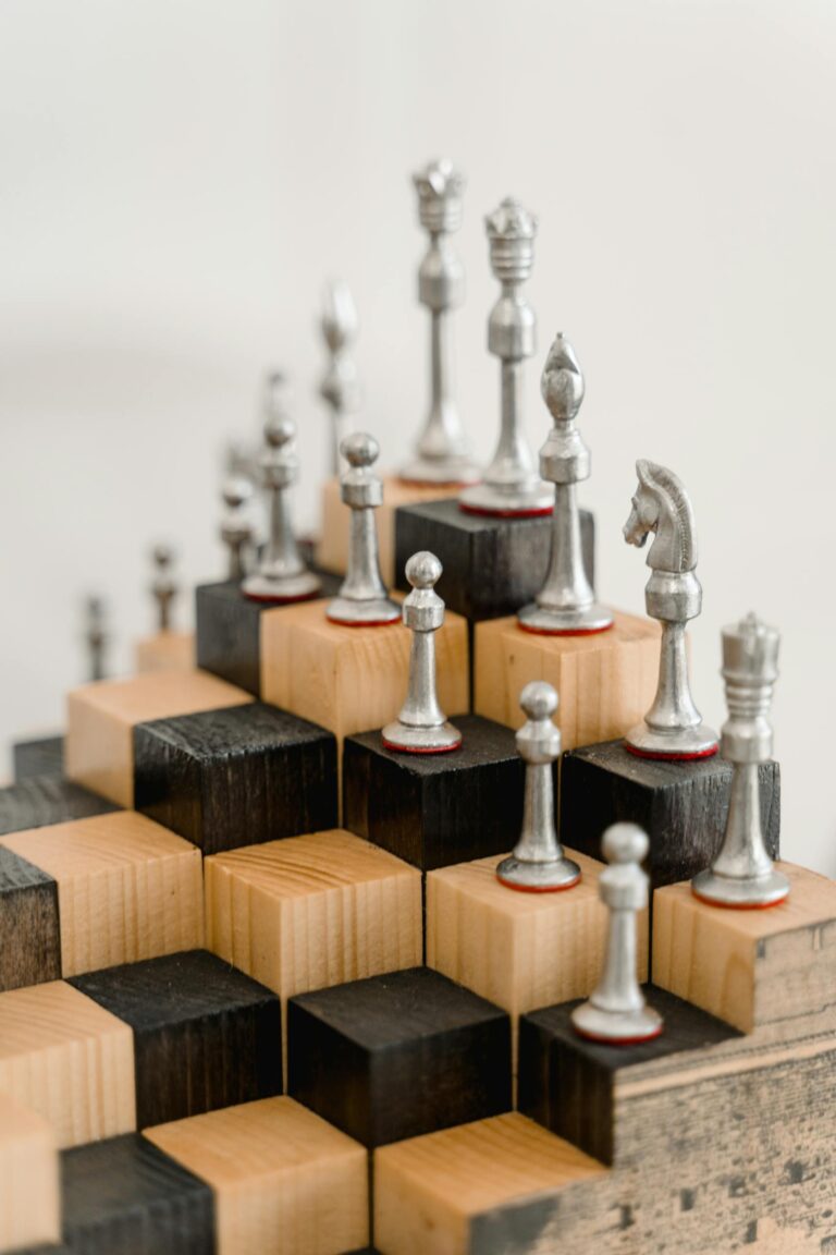 4 horsemen Artistic arrangement of chess pieces on stacked wooden blocks in a modern setup.