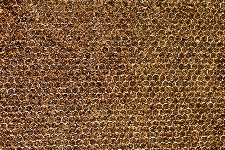 Detailed close-up of a brown textured pattern, resembling natural elements. Ideal for backgrounds.